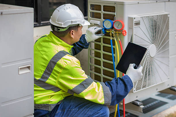Professional Heat Pump Repair technician working in Plano, IL